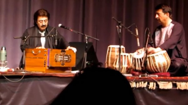 Harmonium (that's the box with a keyboard and enclosed bellows): Khalil Ragheb 
Tula (flutelike instrument): Pervez Sakhi

A ghazal is a "a poetic expression of both the pain of loss or separation and the beauty of love in spite of that pain." (Wikipedia) It originated in Sufi mysticism--the aspect of Islam that Islamic fundamentalists most despise. This is the kind of music that the Taliban banned during its reign in Afghanistan.
Tabla (pair of tuned drums side by side): Ezmarai Aref
Doyra (single drum): Abbos Kosimov (from Uzbekistan; all the others are from Afghanistan)

This music is very closely related to Indian music, both in style and in instrumentation.

The group, called the Sakhi Ensemble, had CDs you can buy, and Kosimov has his own CD as well (he also performs with the group Masters of Percussion).